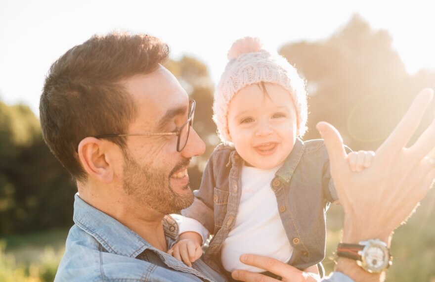 Father holding a small child